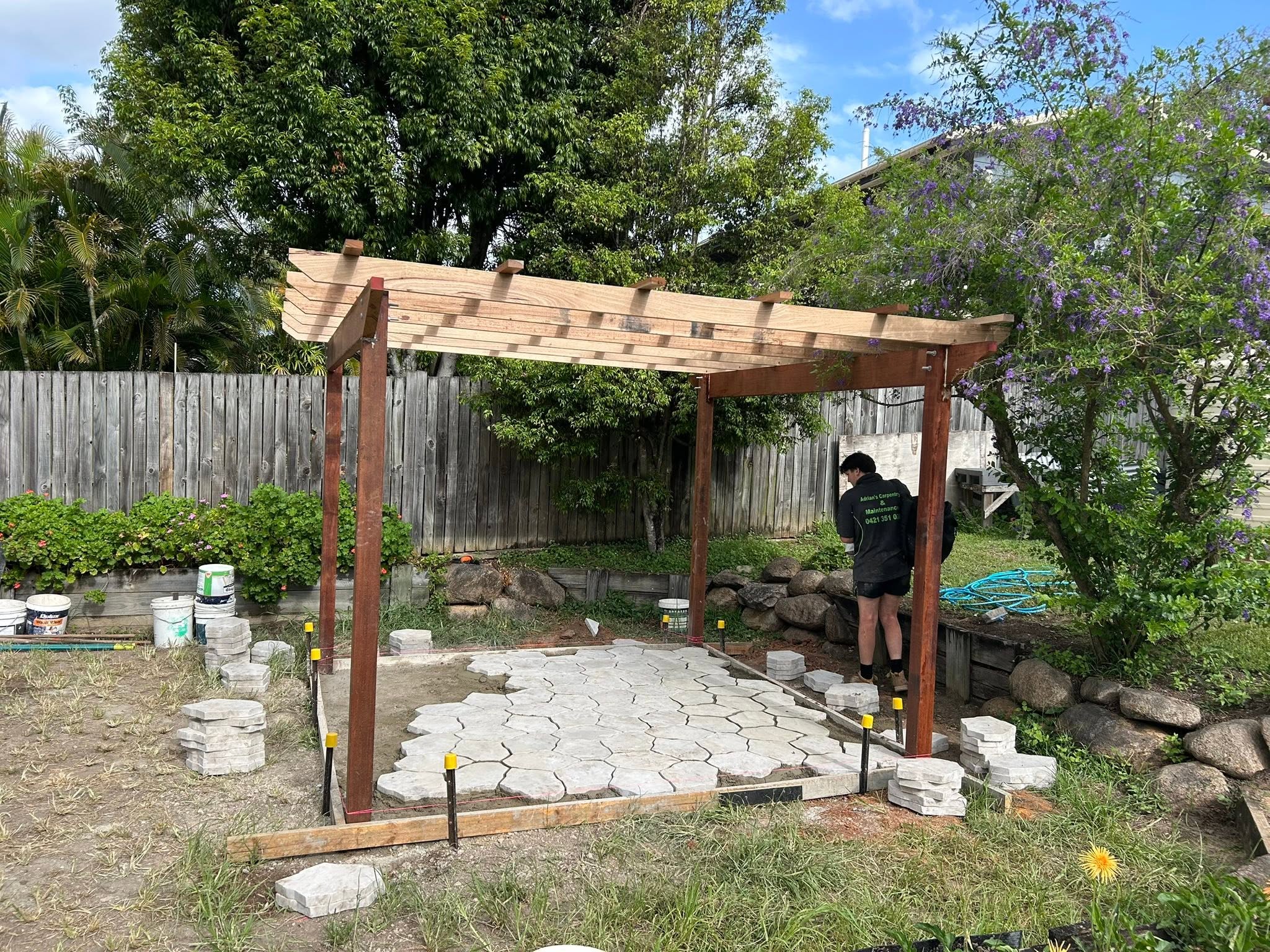 Outdoor pergola and paving project under construction